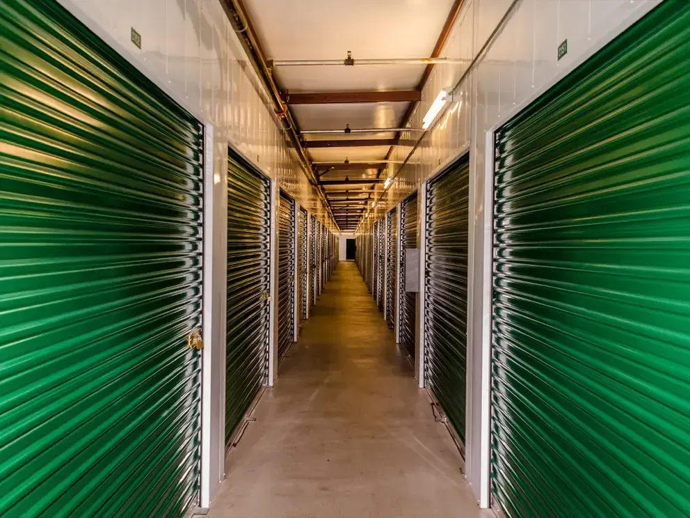 Indoor storage units down a well-lit hallway